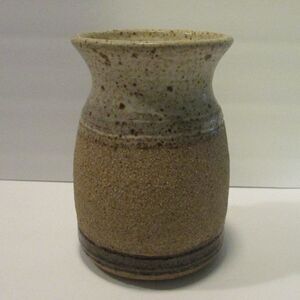 signed pottery vase variations of brown speckled with texture